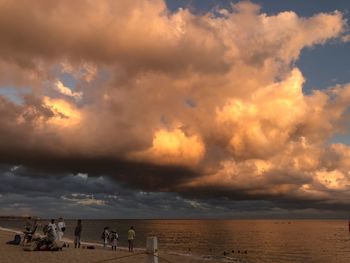 Scenic view of beach against sky during sunset