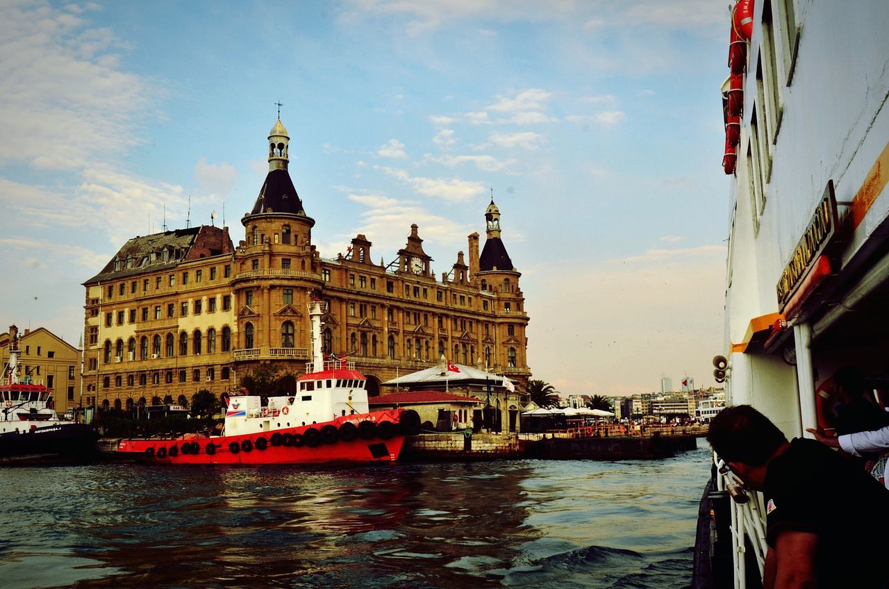 architecture, built structure, building exterior, transportation, nautical vessel, water, mode of transport, sky, boat, waterfront, canal, river, city, cloud - sky, travel, incidental people, moored, travel destinations, bridge - man made structure, cloud