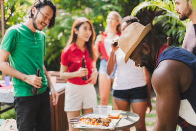 Friends enjoying party in yard