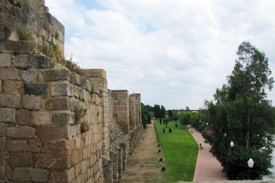 Panoramic view of stone wall against sky