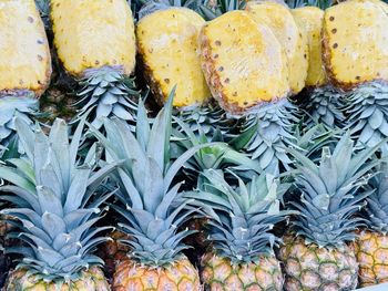 Arranged stack pineapples for sale  