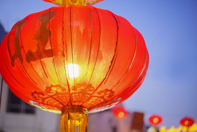 Low angle view of lantern against clear sky