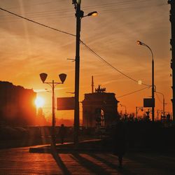 Street lights in city during sunset