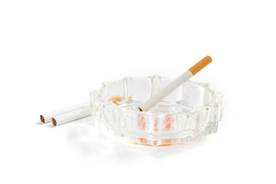 Close-up of cigarette against white background