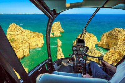 Scenic view of sea seen through airplane window