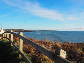 Scenic view of sea against blue sky