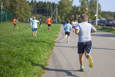 Group of people playing on grassland