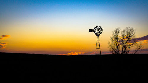 Low angle view of silhouette tree against sky at sunset