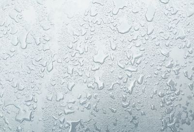 Close-up of water drops on glass