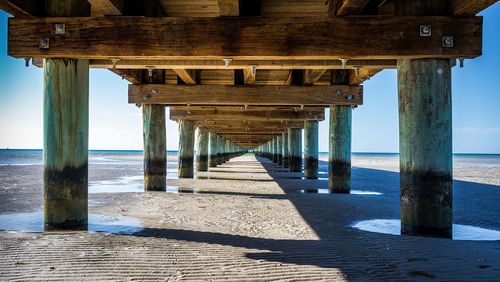 Pier over sea against sky