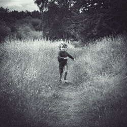 Full length of man walking on field