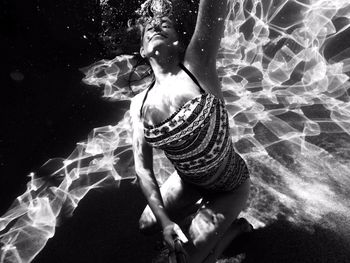 Close-up of woman standing in pond