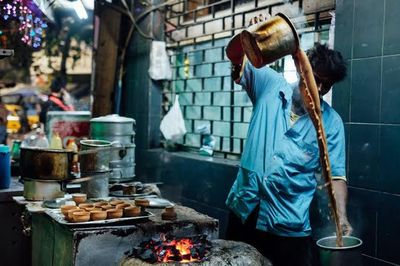 Side view of a person preparing food