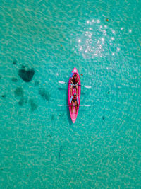 Men and women in kayak in the ocean of the tropical island of koh mak thailand