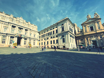 Buildings by street in city