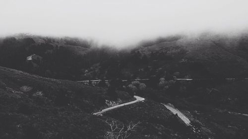 Scenic view of mountains in foggy weather