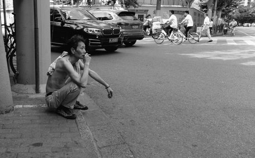 Full length of boy on street in city