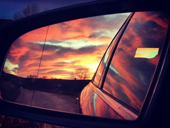 Reflection of sky on side-view mirror