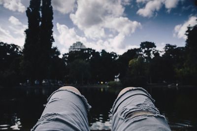 Close-up of feet of a man wearing jeans