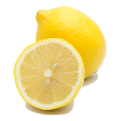 Close-up of lemon against white background