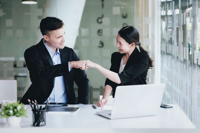 Business colleagues working at office