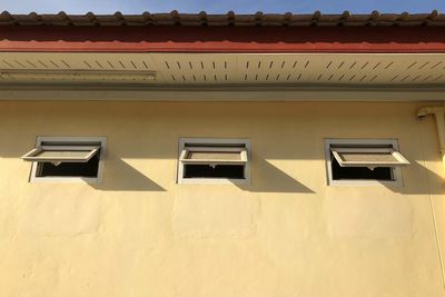 Low angle view of ventilator windows of building