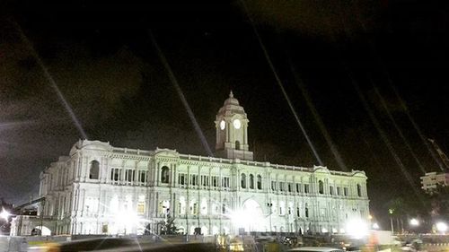 Facade of historic building at night