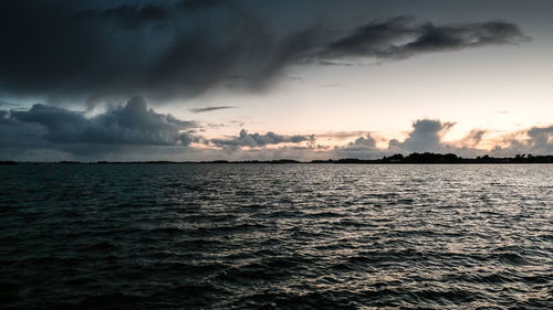 Scenic view of sea against dramatic sky