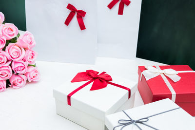 Close-up of multi colored paper in box on table