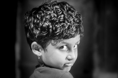 Close-up of boy looking away