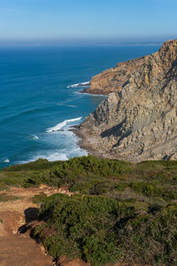 Sea cliffs landscape in cabo espichel at sunset, in portugal