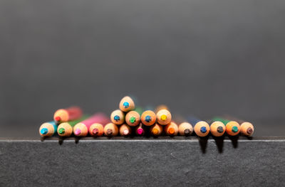 Close-up of multi colored candles on table