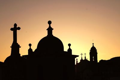 Low angle view of church against clear sky during sunset