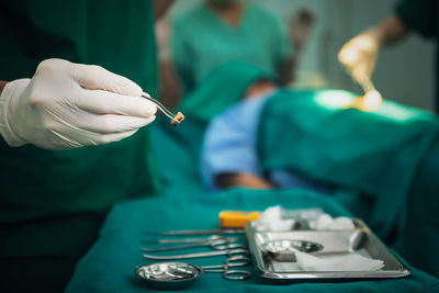 Midsection of man working on table