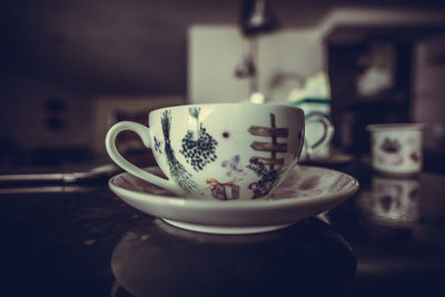 Close-up of coffee cup on table
