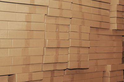 Stack of cardboard boxes stacked in large rows. abstract background.