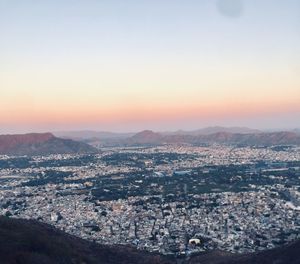 High angle view of townscape against sky during sunset