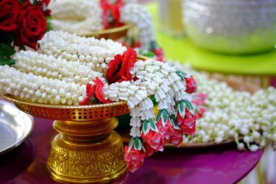 Close-up of floral garlands in container