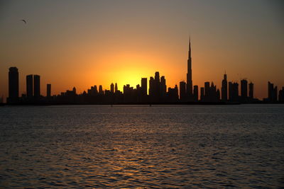 Dubai slyline from dubai creek harbour and dubai canal to downtown and business bay, uae