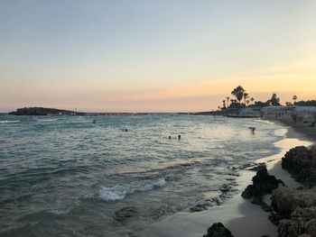 Scenic view of sea against clear sky during sunset