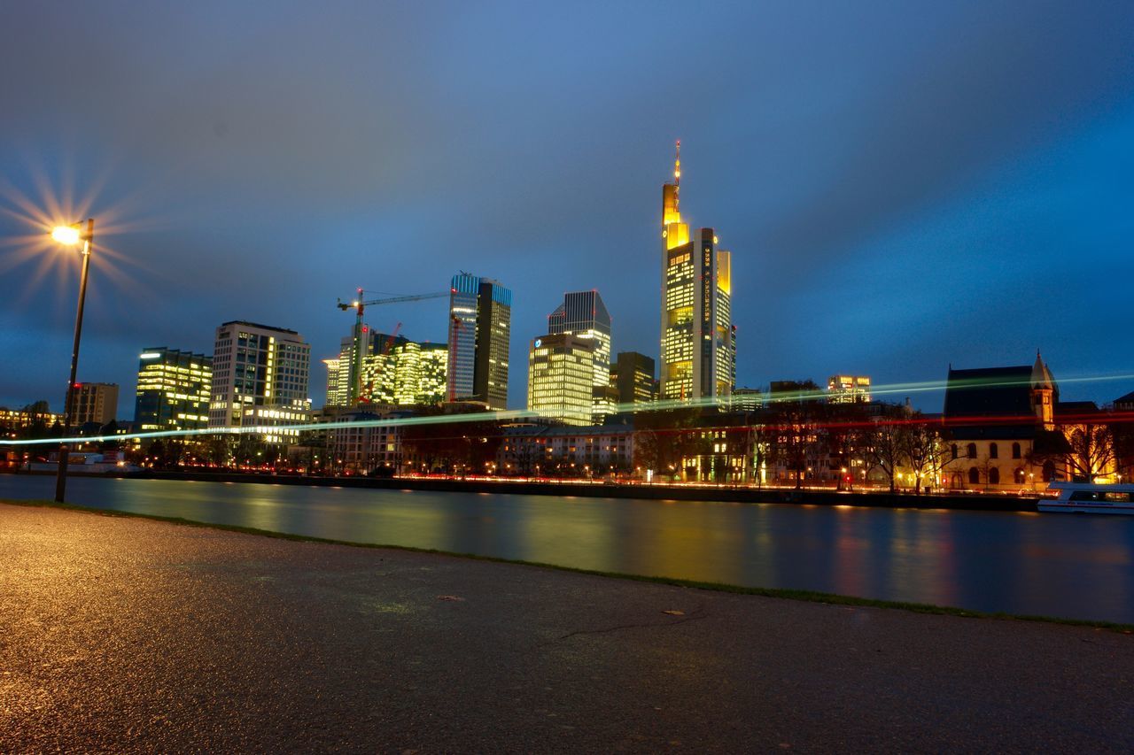 illuminated, night, architecture, city, skyscraper, urban skyline, reflection, sky, tower, cityscape, built structure, no people, modern, building exterior, road, outdoors, water