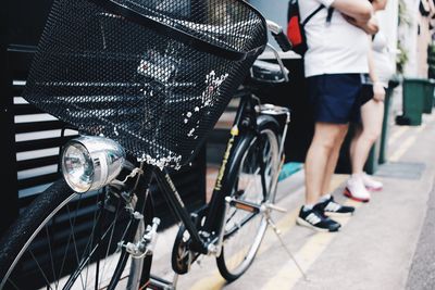 Close-up of bicycle parked at street