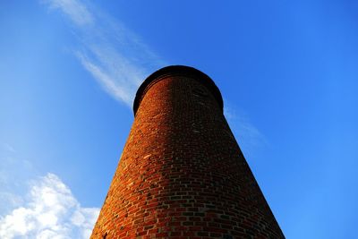 Low angle view of tower against sky at night