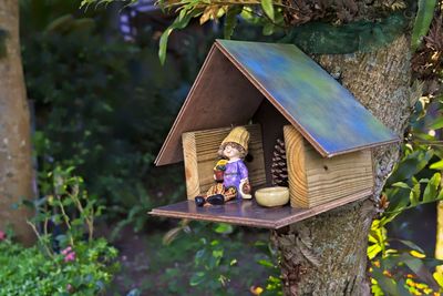 High angle view of toy sitting on chair at yard