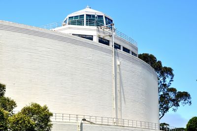 Low angle view of built structure against clear blue sky