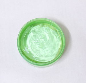 High angle view of green plastic on white background
