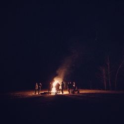 View of illuminated people at night