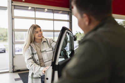 Woman in car dealership office