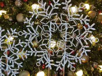 Close-up of illuminated christmas tree during winter