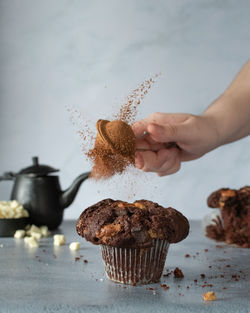 Midsection of person holding cake